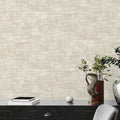 Beige textured wallpaper with a desk and decorative items in the foreground