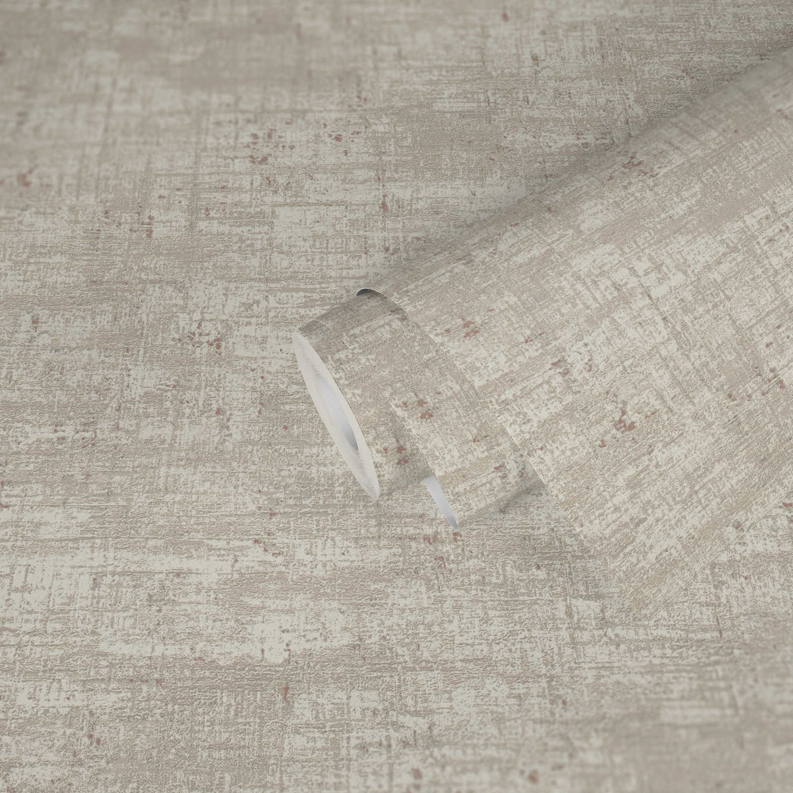 Roll of textured beige wallpaper with a slight pattern