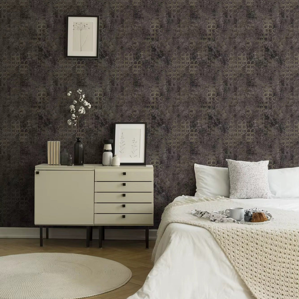 Neatly arranged bedroom with a dresser and bed against a patterned wall.