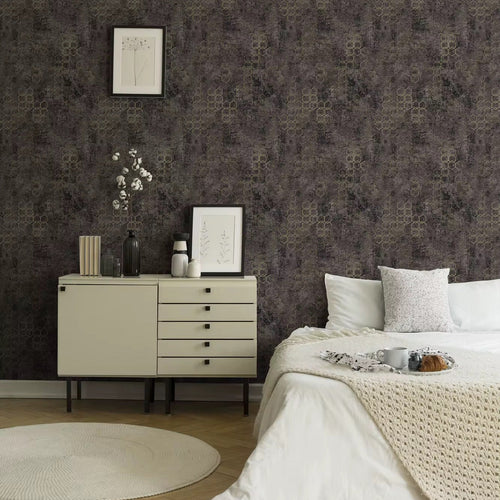 Neatly arranged bedroom with a dresser and bed against a patterned wall.