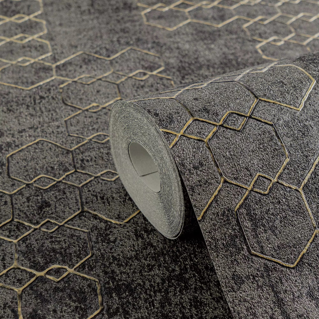 Roll of textured gray wallpaper with geometric pattern on a matching surface