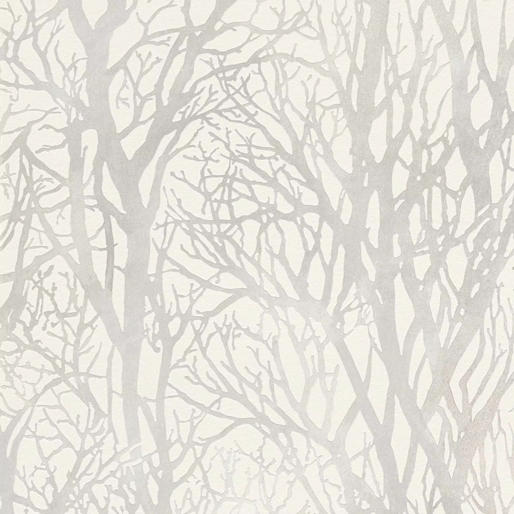 Silhouette of tree branches on a light gray textured wallpaper