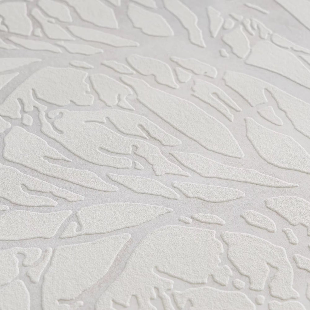 Textured white wallpaper with abstract leaf-like patterns